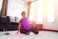 Asian women exercise doing yoga poses workout at home