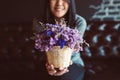 Asian woman hand holding beautiful flowers at restaurant,Happy and smiling,Relaxing time,Close up Royalty Free Stock Photo