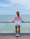 Asian women with hat by swimming pool in Pattaya Thailand Ban Amphur beach