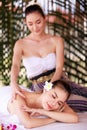 woman having massage in the spa salon, beauty, health care body skin natural herbs and essential oils treatment. concept Royalty Free Stock Photo