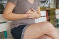 Asian woman having or symptomatic reflux acids,Gastroesophageal reflux disease,Because the esophageal sphincter that separates the Royalty Free Stock Photo