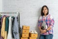 Asian women holding laptop computer selling online start up small business owner Royalty Free Stock Photo