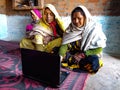 asian women learning about laptop technology togather at village home in india January 2020 Royalty Free Stock Photo