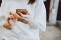 Asian women Listening to music happily with headphones on the phone during the day, relaxing from stressful activities throughout Royalty Free Stock Photo