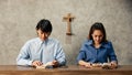 Asian Women and men, The faithful and Christian are reading the Bible to pray to Jesus in the crucified church. Concept believe Royalty Free Stock Photo