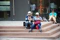 Asian women mother and daughter sitting resting on stairs in Heidelberg, Germany