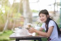 Asian women playing mobile phones and drinking iced tea Royalty Free Stock Photo