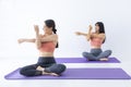 Asian woman practicing yoga indoor with easy and simple position to control breathing in and out in stretching arm posture