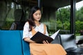 Asian women reading book and smiling and happy Relaxing in a coffee shop Royalty Free Stock Photo