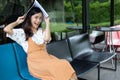 Asian women reading and smiling and happy Relaxing in a coffee s Royalty Free Stock Photo