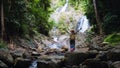 Asian women relax in the holiday. Travel waterfall On the Moutain Huai Toh waterfall at Krabi. travel nature, Travel relax, Royalty Free Stock Photo