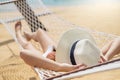 Asian women relaxing in hammock summer holiday on beach Royalty Free Stock Photo