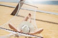 Asian women relaxing in hammock summer holiday on beach Royalty Free Stock Photo