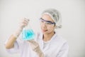 Asian women scientist with test tube making research in clinical laboratory.Science, chemistry, technology, biology and people con Royalty Free Stock Photo