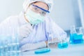 Asian women scientist with test tube making research in clinical laboratory.Science, chemistry, technology, biology and people con Royalty Free Stock Photo