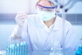 Asian women scientist with test tube making research in clinical laboratory.Science, chemistry, technology, biology and people con Royalty Free Stock Photo