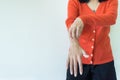 Asian woman scratch itch with her arm,Itching and scratching,Copy space on white blackground Royalty Free Stock Photo