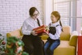 Asian woman send a christmas gift box to younger sister at house,Happy and smiling