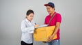 Asian Women are signed Document to receive items from the cargo staff After buying new home and moving home in delivery service