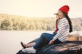 Asian women sitting on rock in nature Royalty Free Stock Photo