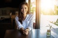 Asian women smiling and happy Relaxing in a coffee shop after working in a successful office