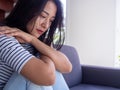 Asian women are stressed, sitting worrying about family problems, heartbreaking and have mental symptoms