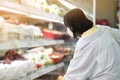 Asian women and surgical mask shopping some food in supermarket, covid-19 crisis Royalty Free Stock Photo