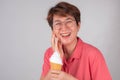 Asian women with toothache after biting ice cream on a white background Royalty Free Stock Photo