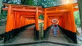 Asian women in traditional japanese kimonos at Fushimi Inari Shrine in Kyoto, Japan.