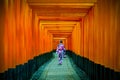 Asian women in traditional japanese kimonos at Fushimi Inari Shrine in Kyoto, Japan