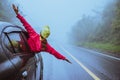 Asian women travel relax in the holiday. driving a car traveling happily. Amid the mist rainy