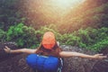 Asian women travel relax in the holiday. Sit on a rocky cliff. Mountain View Thailand Royalty Free Stock Photo