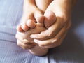 Adult women use hands massage on toes with numbness nerves and foot pain