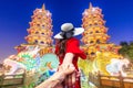 Asian women visit Dragon and the tiger pagoda at the lotus pond and the reflections at night