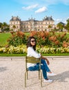 Asian women visiting Le Jardin Luxembourg park in Paris during summer in the city of Paris France