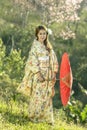 asian women wearing traditional japanese kimono and red umbrella Royalty Free Stock Photo