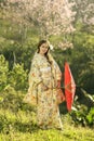 Asian women wearing traditional japanese kimono and red umbrella Royalty Free Stock Photo