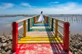 Asian women wearing white dresses are standing on the bridge at Rainbow Bridge, Kalong village, Samut Sakhon province, Thailand Royalty Free Stock Photo