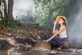 Asian women working in creek