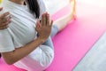 Asian women in yoga poses close up in her hands in yoga studio with natural light setting scene / exercise concept / yoga practice