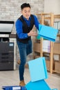 asian worker carrying files falling