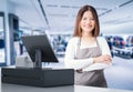 Asian worker with cashier desk Royalty Free Stock Photo