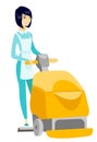 Asian worker cleaning store floor with machine. Royalty Free Stock Photo