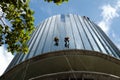 Asian worker climb on building, dangerous job