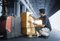 Asian Worker Holding Clipboard His Doing Inventory Management at Storage Warehouse. Checking Stock Package Boxes. Royalty Free Stock Photo