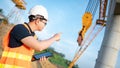 Asian worker using digital tablet at construction site Royalty Free Stock Photo