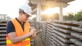 Asian worker using digital tablet at construction site Royalty Free Stock Photo