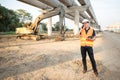 Asian worker using digital tablet at construction site Royalty Free Stock Photo