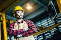 Asian worker wearing the goggle, helmet, ear muff equipment in production plant Royalty Free Stock Photo