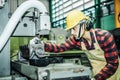 Asian worker wering the goggle, helmet, ear muff equipment in production plant Royalty Free Stock Photo